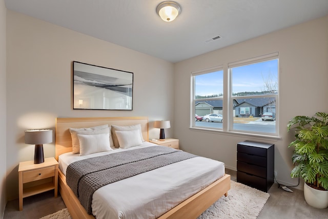 bedroom featuring visible vents and baseboards