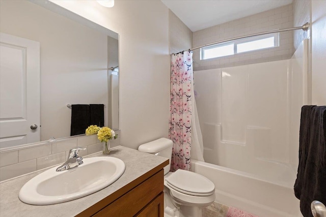 bathroom featuring shower / bath combination with curtain, toilet, and vanity