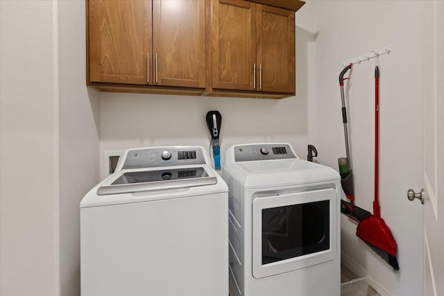 laundry area featuring cabinet space and independent washer and dryer