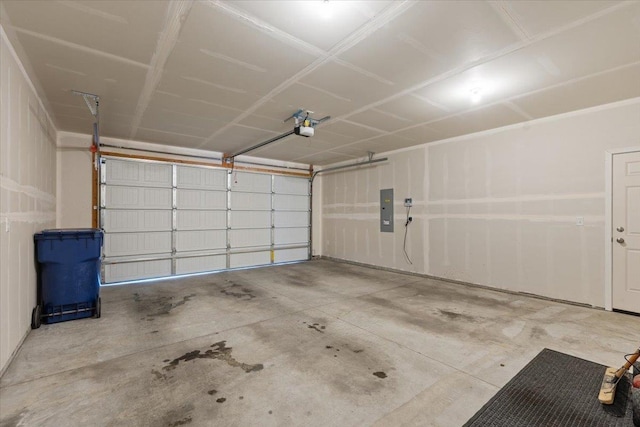 garage featuring electric panel and a garage door opener