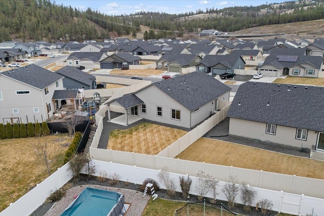 birds eye view of property with a residential view