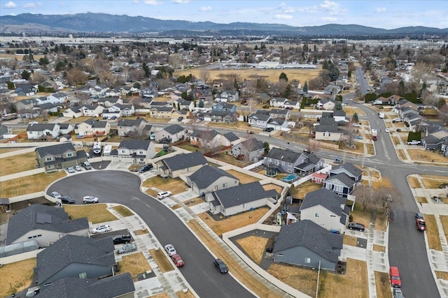 birds eye view of property with a mountain view and a residential view