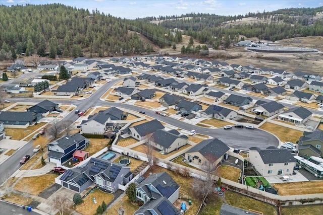 bird's eye view with a residential view and a wooded view