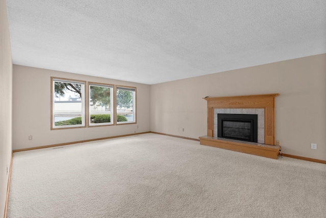 unfurnished living room with a fireplace, carpet, and baseboards