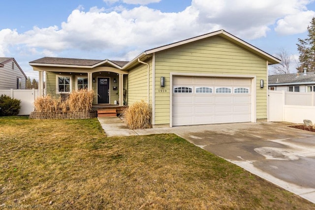 ranch-style home with an attached garage, concrete driveway, a front yard, and fence