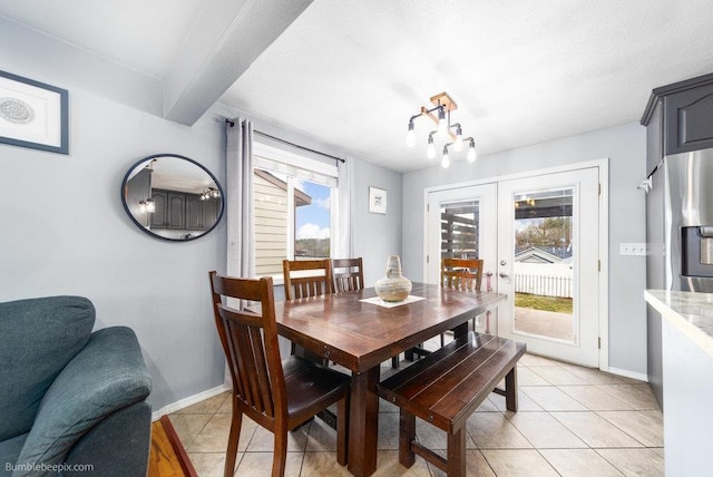 dining room with beamed ceiling, light tile patterned floors, french doors, and baseboards