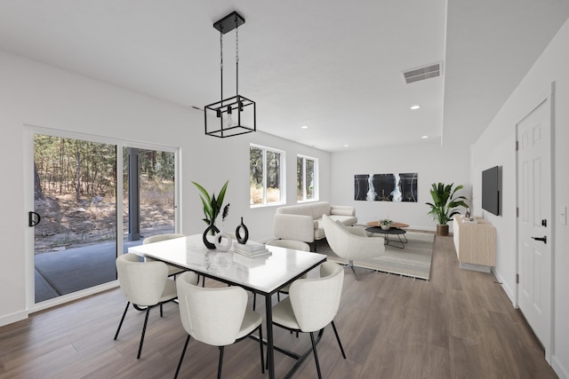 dining area with recessed lighting, wood finished floors, visible vents, and baseboards