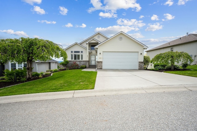 view of front of home featuring brick siding, a garage, driveway, and a front yard