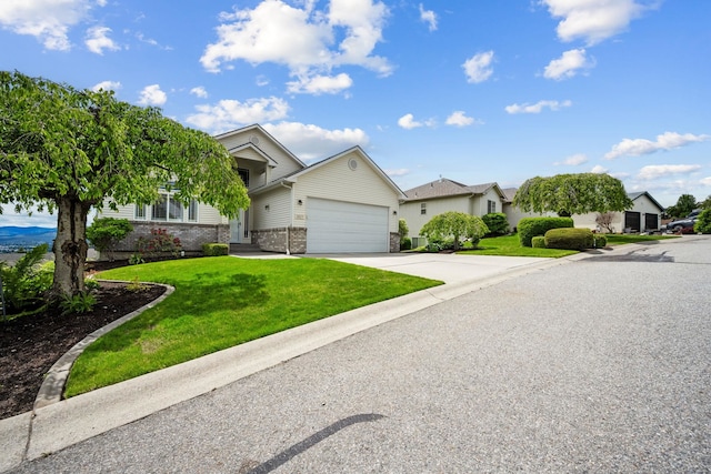 view of front of house with concrete driveway, an attached garage, brick siding, and a front lawn