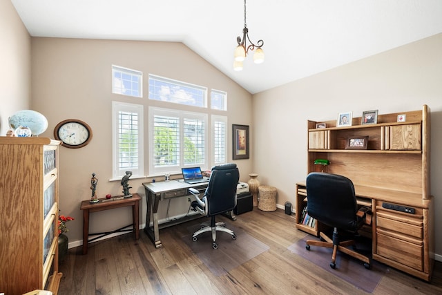 office featuring dark wood-type flooring, baseboards, and vaulted ceiling