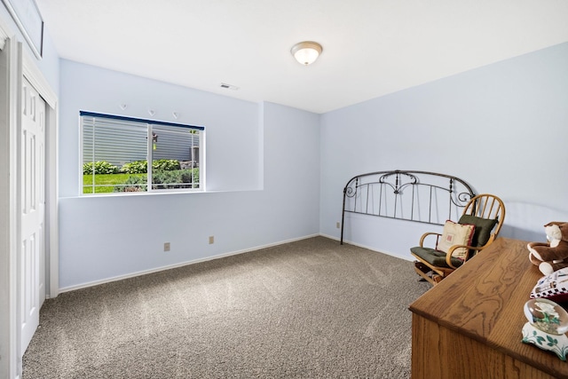 unfurnished bedroom featuring visible vents, baseboards, and carpet