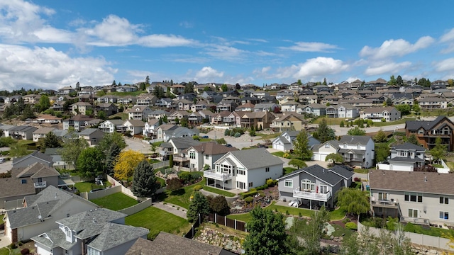 birds eye view of property with a residential view