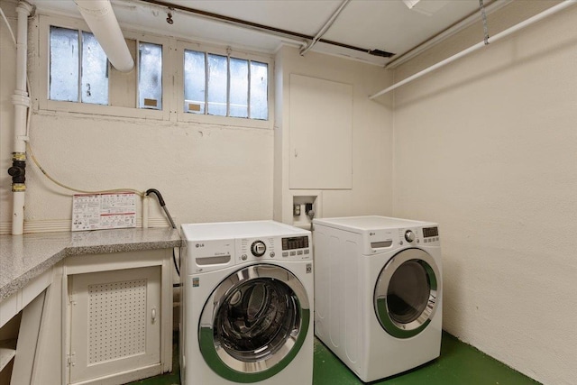 laundry area featuring independent washer and dryer, laundry area, and a healthy amount of sunlight