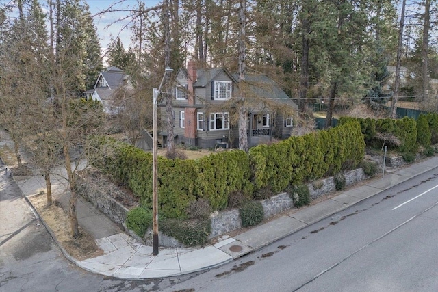 view of front of house featuring a chimney