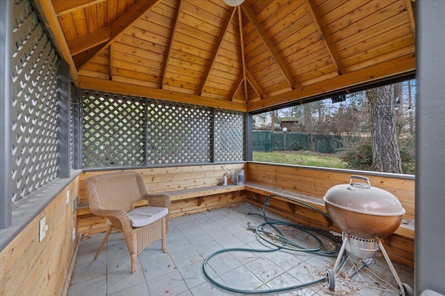 sunroom / solarium with lofted ceiling with beams and wooden ceiling