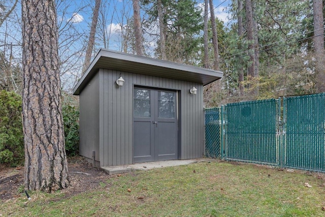 view of shed with fence