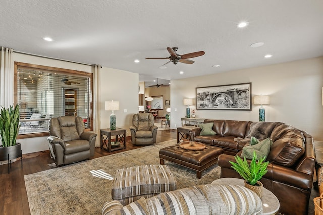 living room with recessed lighting, wood finished floors, a textured ceiling, and ceiling fan