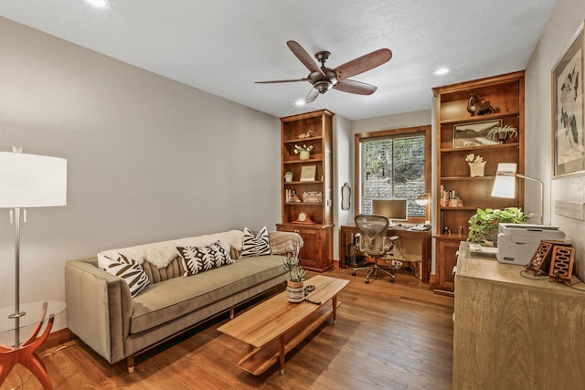 living area featuring hardwood / wood-style floors, recessed lighting, and ceiling fan