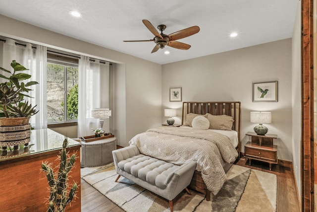 bedroom with recessed lighting, a ceiling fan, and wood finished floors