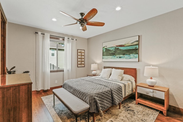 bedroom featuring recessed lighting, baseboards, a ceiling fan, and wood finished floors