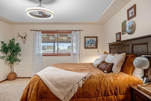 bedroom featuring baseboards and carpet floors