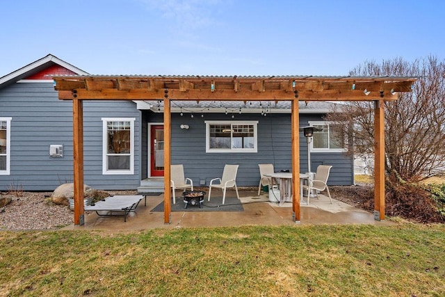 back of property featuring a yard, a patio, entry steps, and a pergola