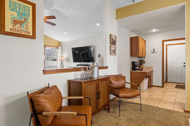 interior space with vaulted ceiling, light tile patterned floors, recessed lighting, and ceiling fan