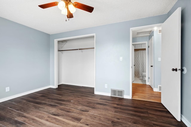 unfurnished bedroom featuring visible vents, baseboards, and wood finished floors