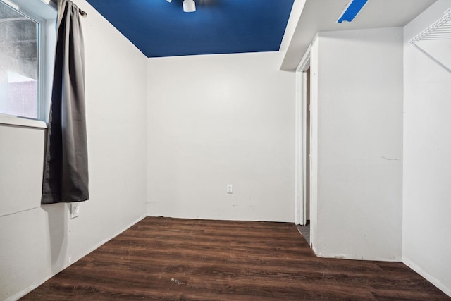 unfurnished room with wood finished floors