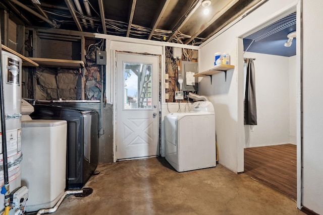 laundry area with washing machine and clothes dryer, laundry area, strapped water heater, and electric panel