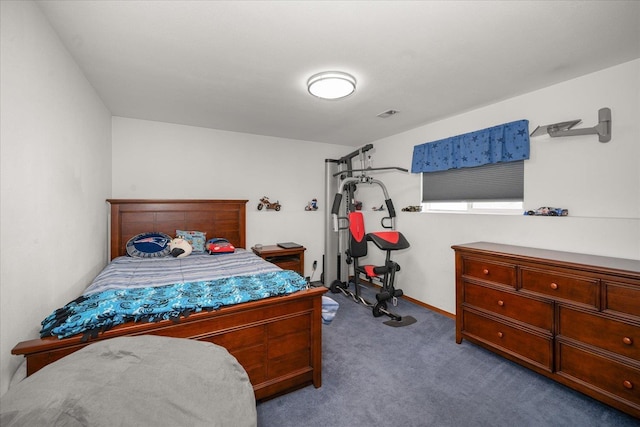 carpeted bedroom featuring visible vents and baseboards