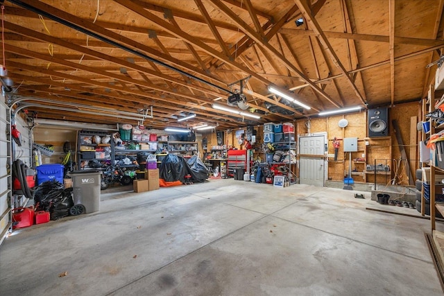 garage featuring a workshop area and a garage door opener