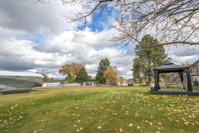 view of yard featuring a gazebo and fence