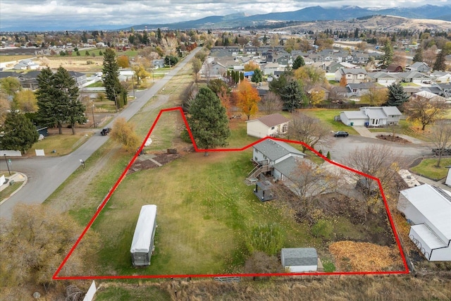 birds eye view of property featuring a mountain view and a residential view