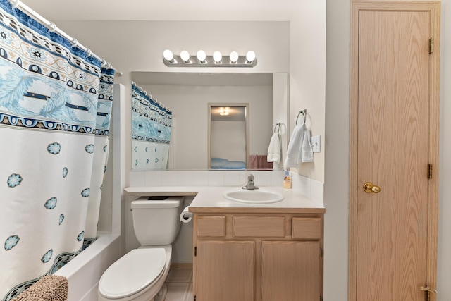 bathroom with shower / bathtub combination with curtain, toilet, and vanity