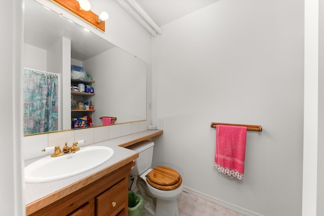 full bathroom with toilet, vanity, and a shower with curtain