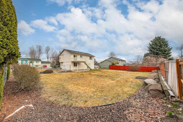 view of yard with a fenced backyard