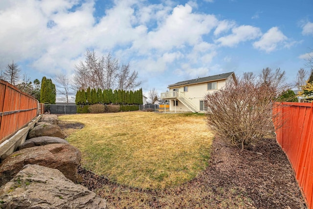 view of yard with a fenced backyard