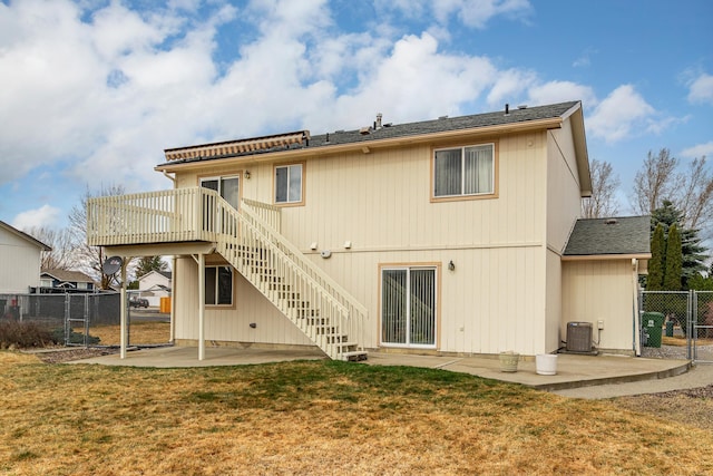 back of property featuring a patio, central AC, fence, a yard, and stairs