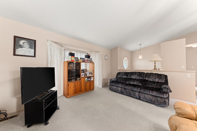 living room featuring baseboards, lofted ceiling, and carpet flooring