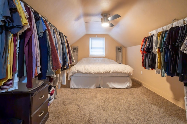 bedroom with baseboards, carpet floors, lofted ceiling, and ceiling fan