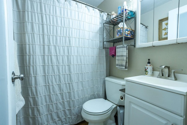 bathroom with a shower with shower curtain, toilet, and vanity