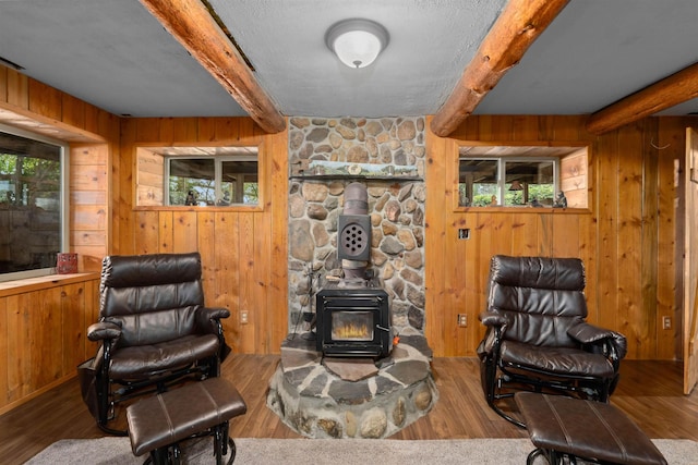sitting room with beam ceiling and plenty of natural light