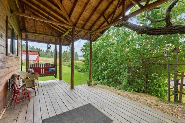 wooden terrace with a yard