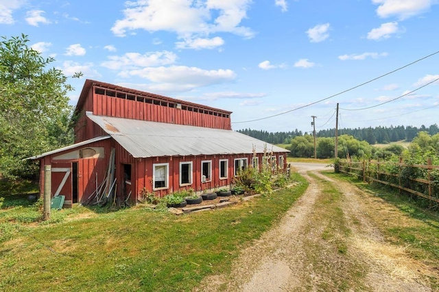 exterior space with dirt driveway