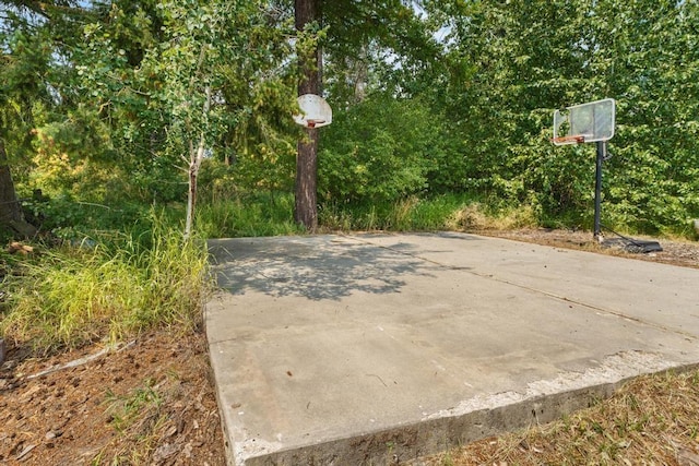 view of basketball court featuring basketball hoop