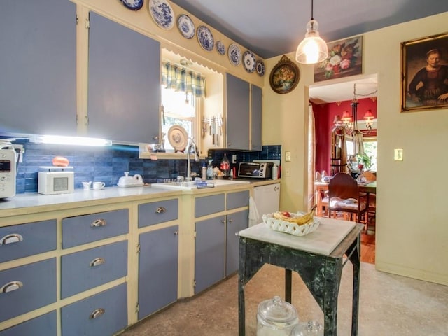 kitchen with a toaster, light countertops, decorative backsplash, white dishwasher, and a sink