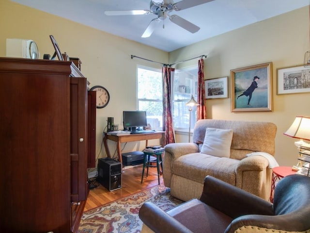 office featuring wood finished floors and a ceiling fan