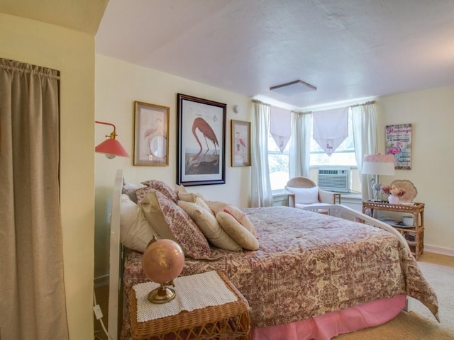 bedroom with baseboards and carpet floors