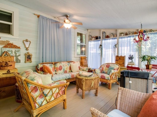 interior space featuring a ceiling fan and wood finished floors